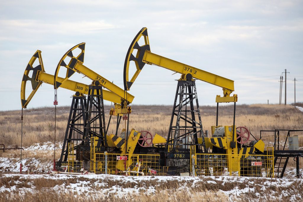 Oil pumping jacks in a Rosneft oilfield near Sokolovka village, Russia.