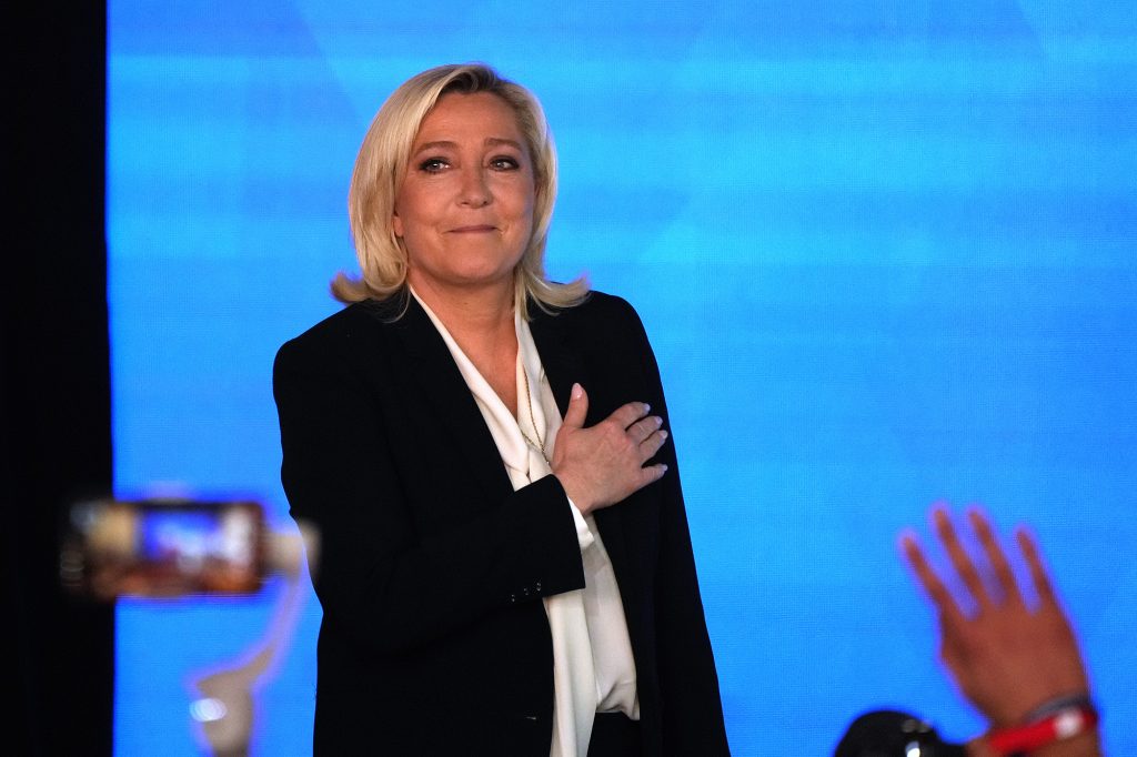 Far-right leader Marine Le Pen gestures as she arrives to speak after the early result projections of the French presidential election runoff were announced in Paris, France, on April 24.